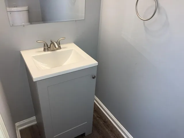 a bathroom with a sink and a mirror