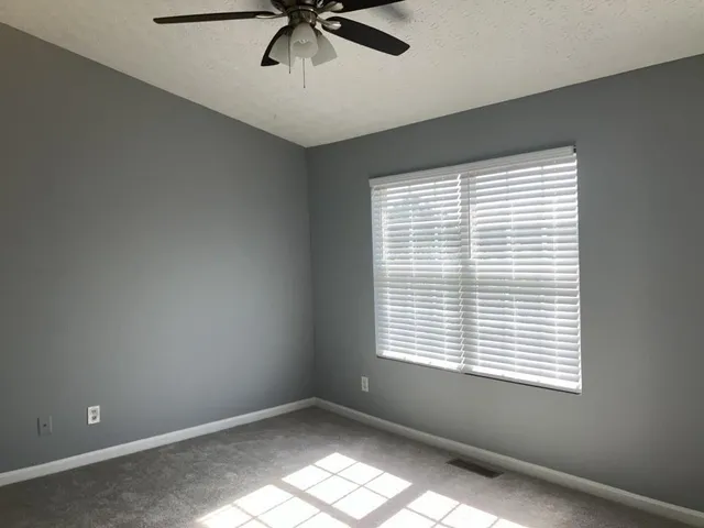 a view of empty room with windows