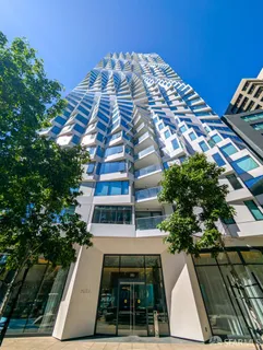 a view of balcony with table and chairs