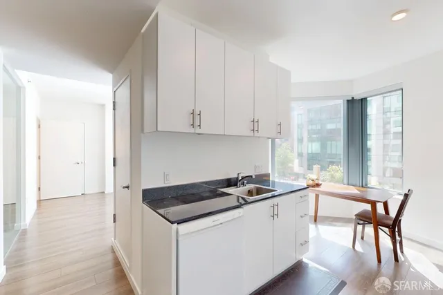 a kitchen that has a cabinets and a stove