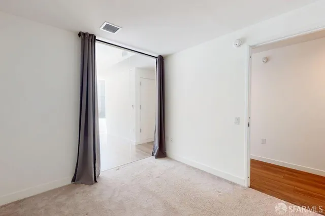 a view of an empty room and window