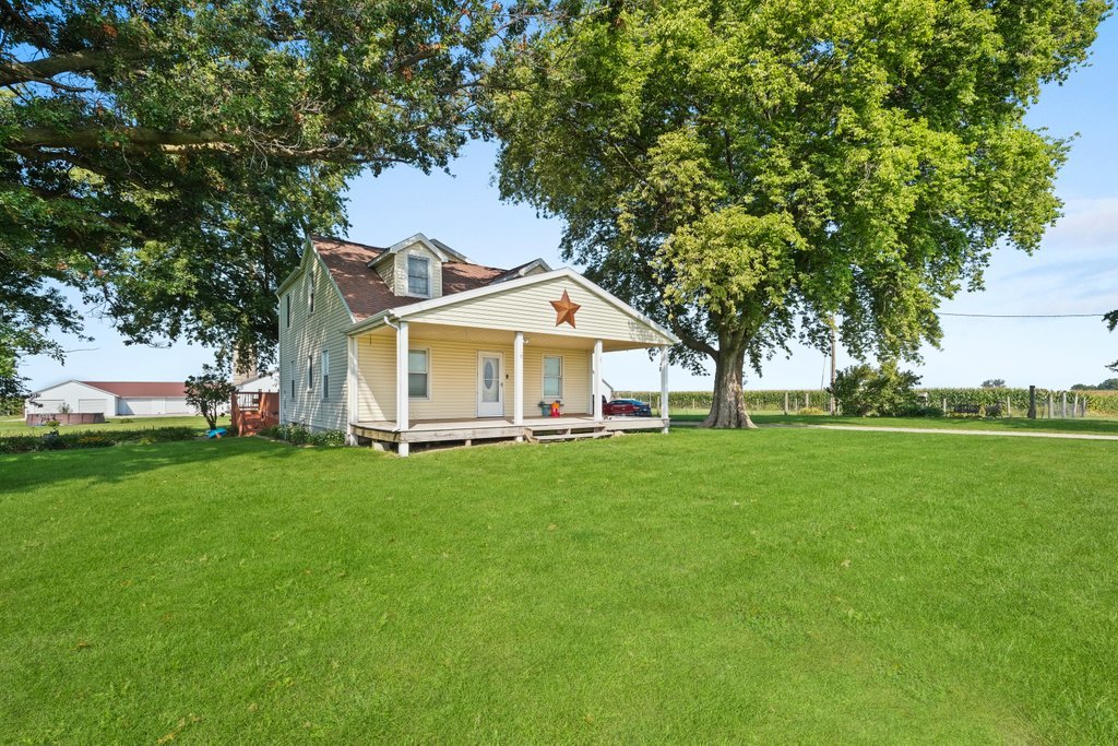 1025 Long Road Harmon, IL 61042 - Photo 54 of 86 a front view of a house with a garden
