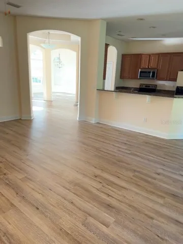 a view of a kitchen from a hallway