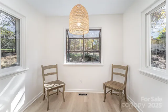 a view of a livingroom with furniture and a window