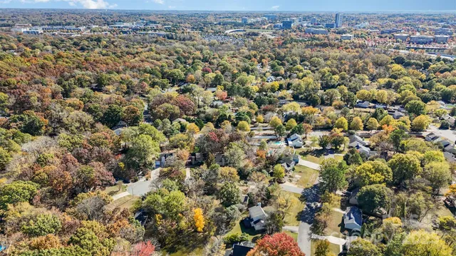 an aerial view of a houses with a city