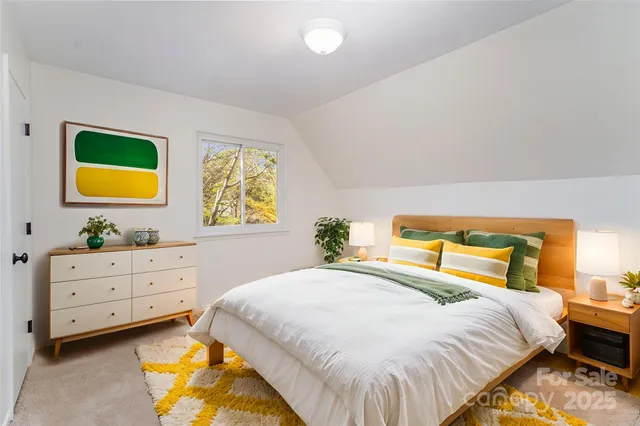 a bedroom with a bed and lamps