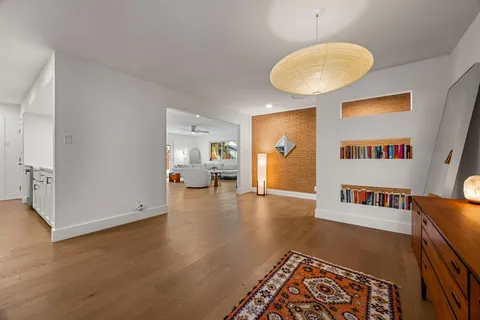 a living room with furniture and a table