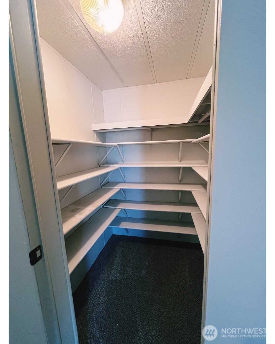 67 Jade Street Walla Walla, WA 99362 - Photo 12 of 21 a storage room with empty racks