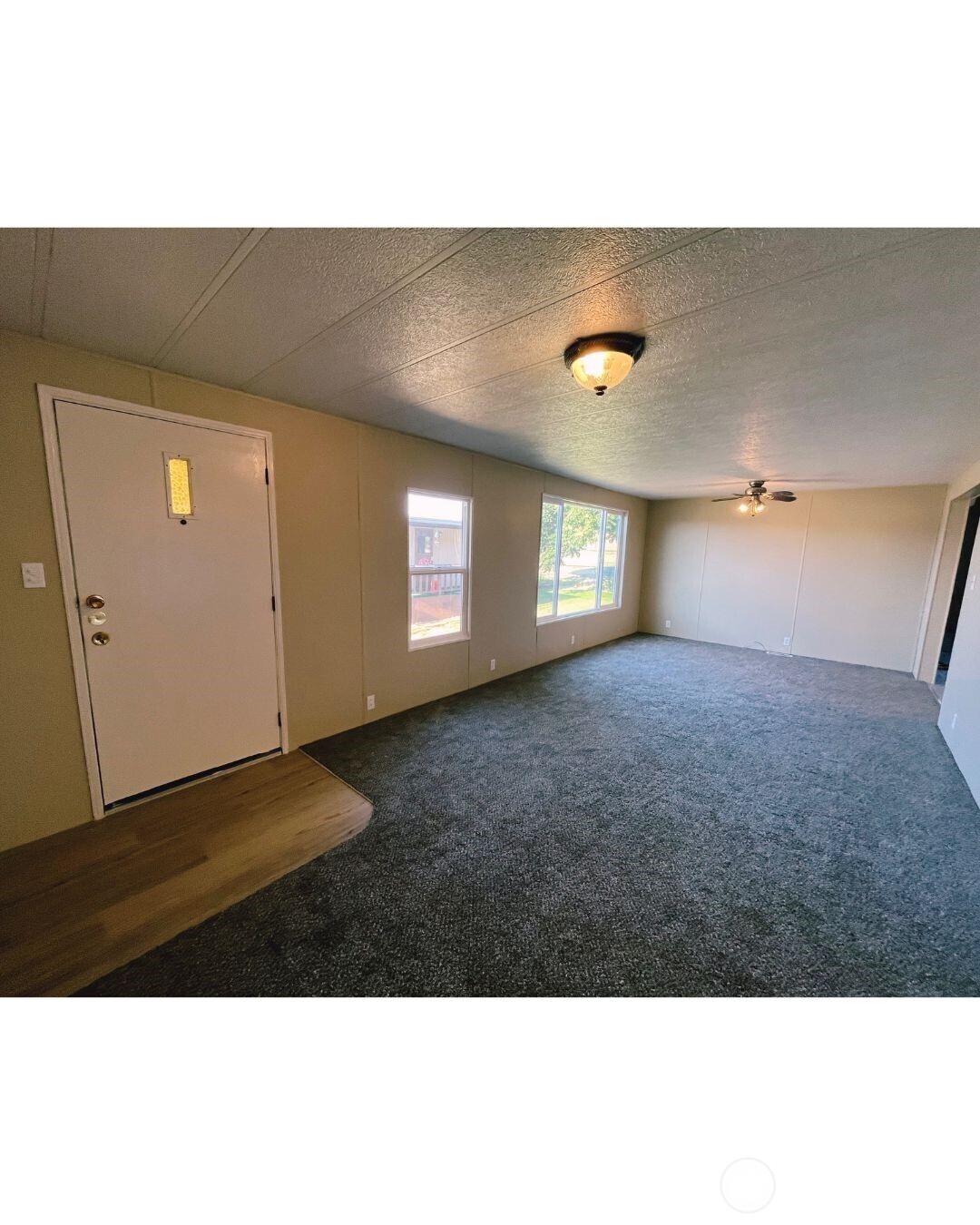 67 Jade Street Walla Walla, WA 99362 - Photo 4 of 21 a view of an empty room with windows and fireplace