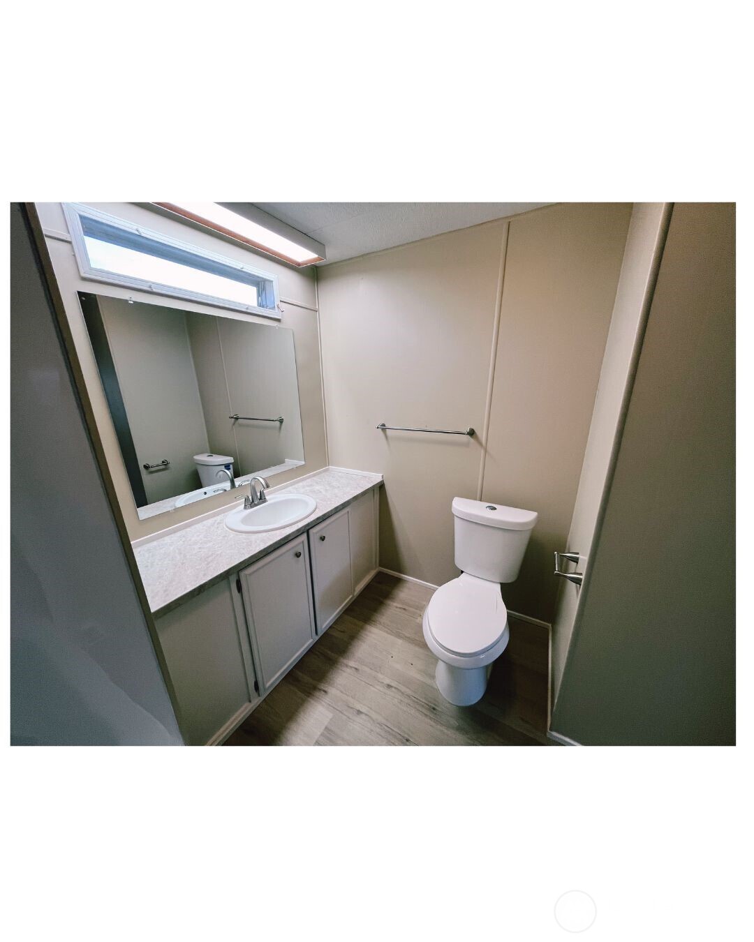 67 Jade Street Walla Walla, WA 99362 - Photo 8 of 21 a bathroom with a toilet sink and mirror