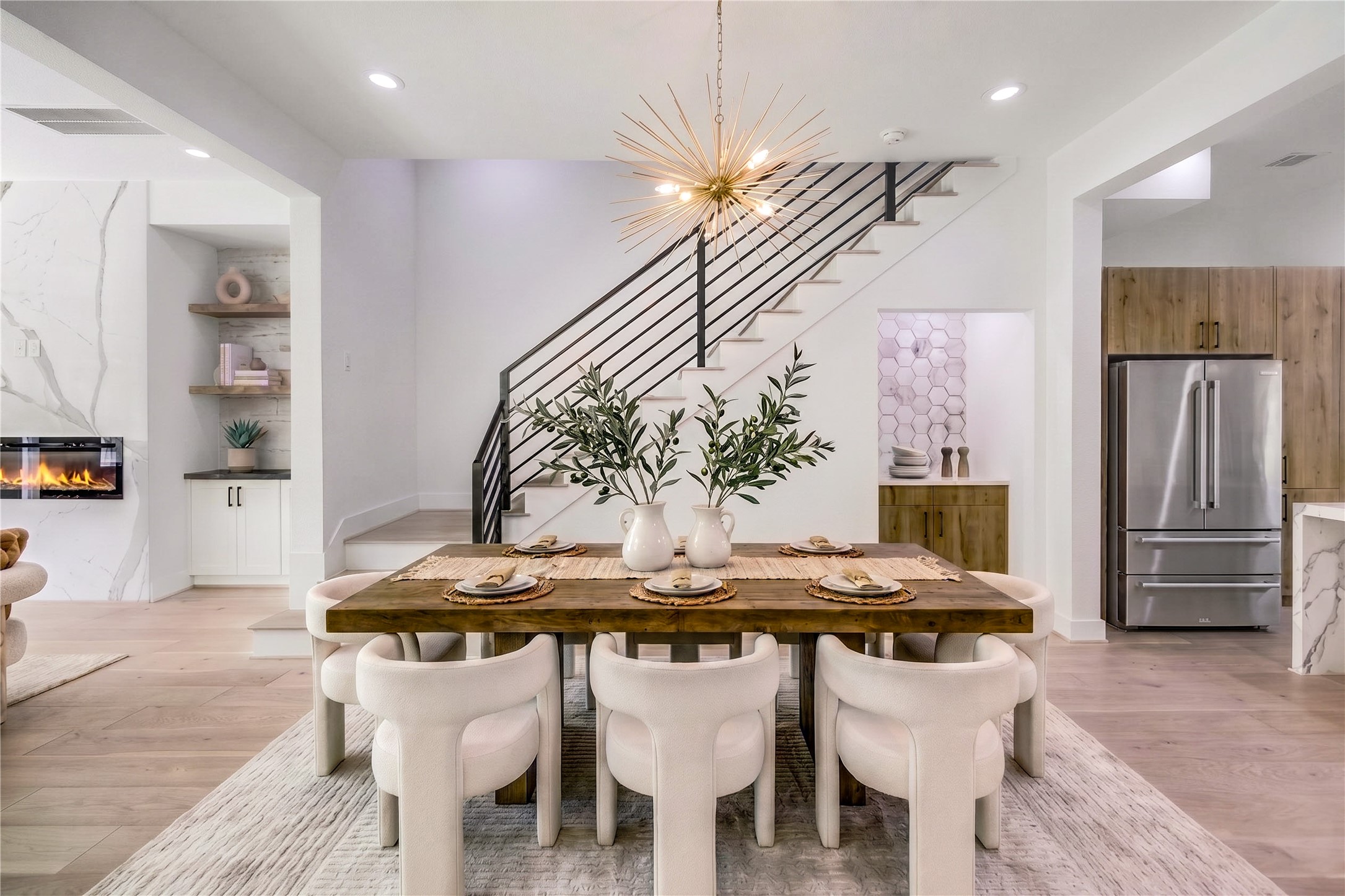 6209 Westcott Street Houston, TX 77007 - Photo 4 of 16 Dining - features a custom designer lighting fixture and a dry bar with quartz countertop.