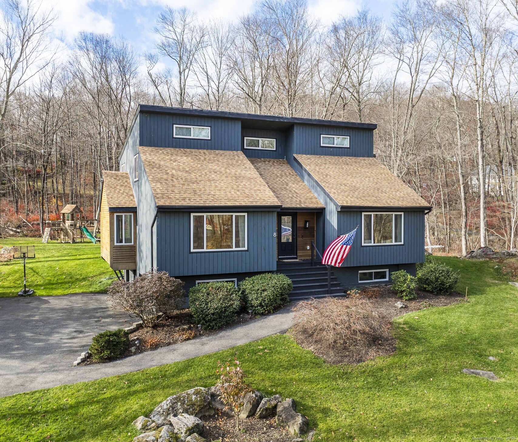 8 Cherokee Drive Brookfield, CT 06804 - Photo 1 of 1 a front view of a house with a yard
