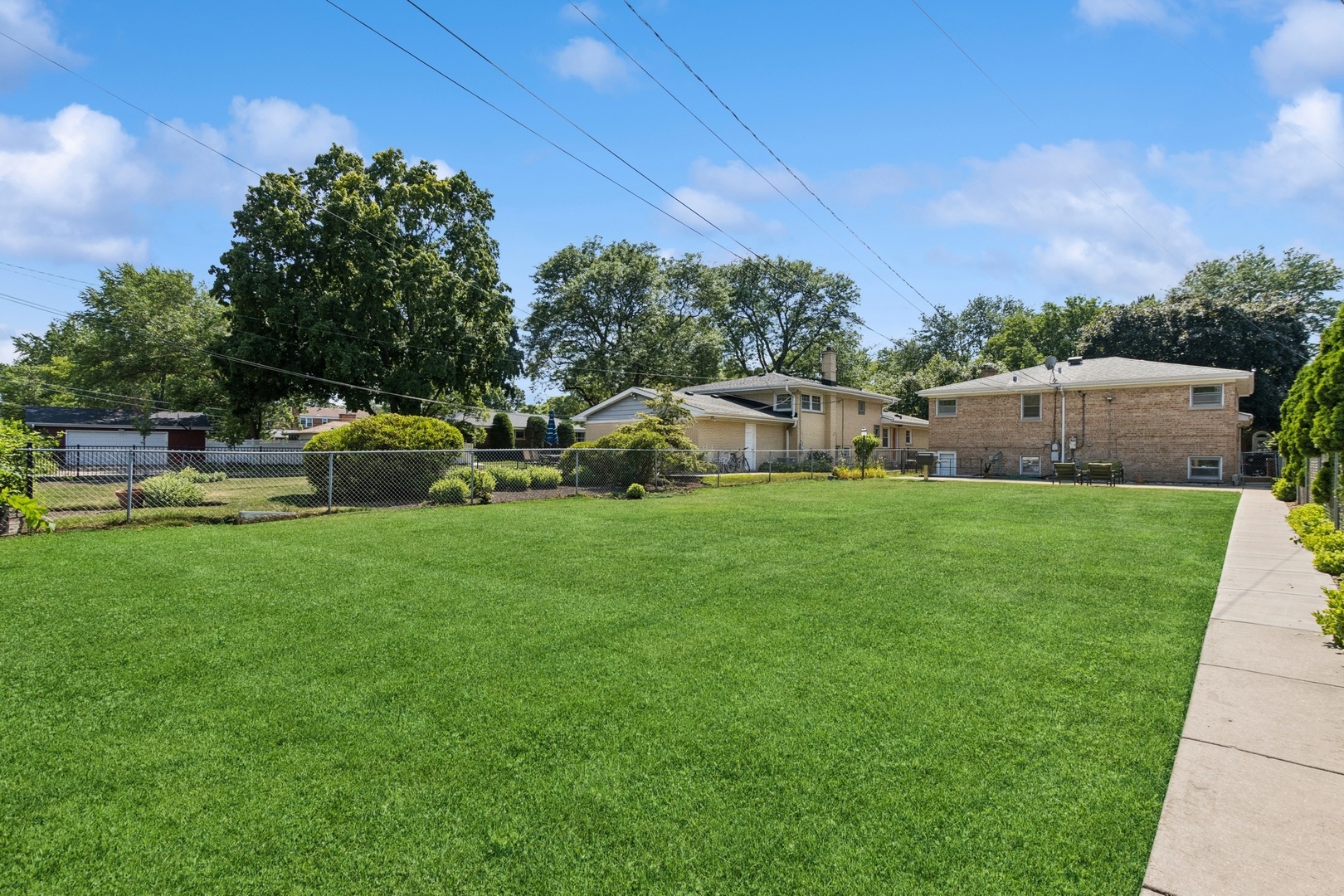 9007 Forestview Road Evanston, IL 60203 - Photo 24 of 29 a view of yard with swimming pool and green space