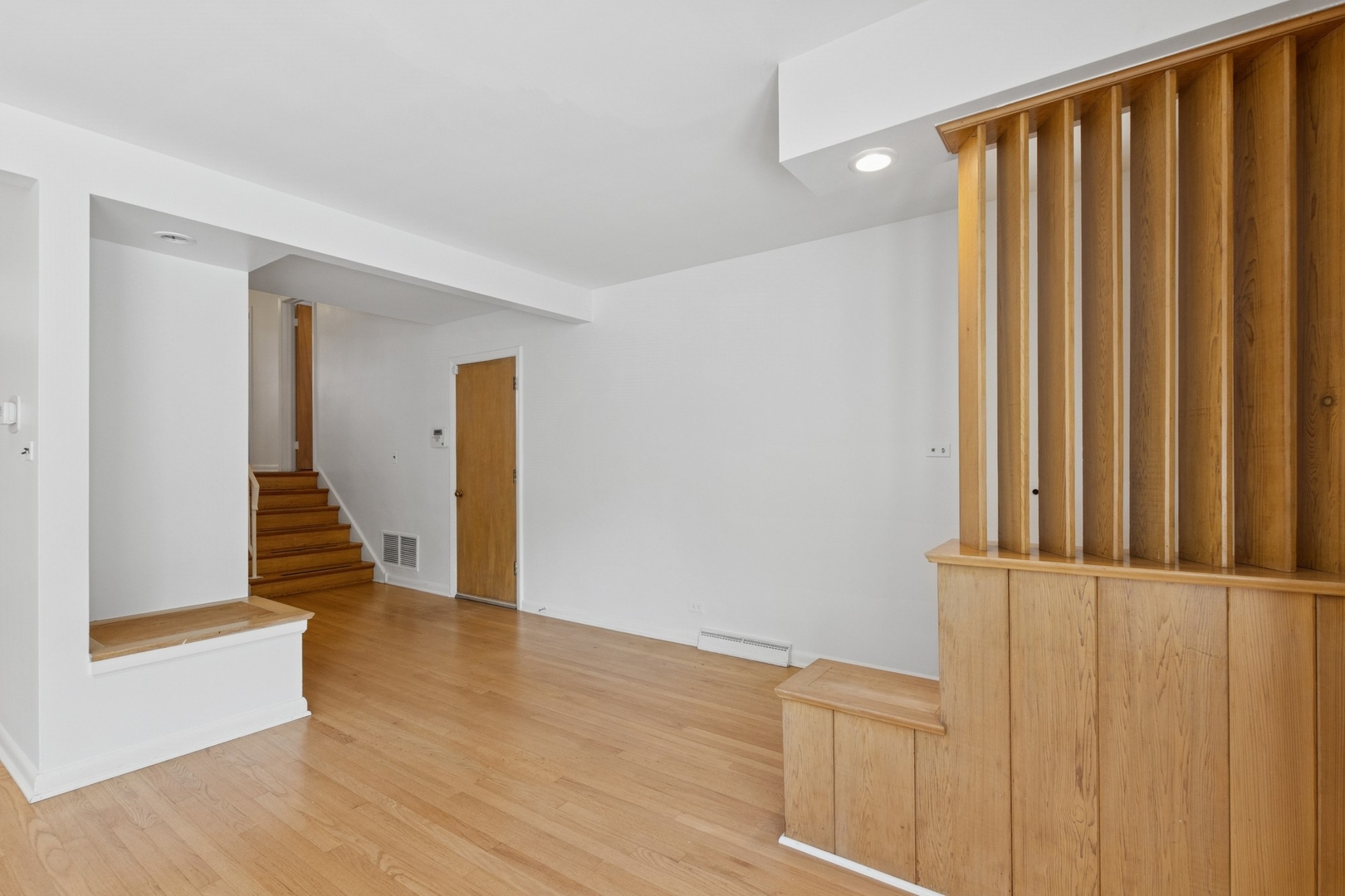 9007 Forestview Road Evanston, IL 60203 - Photo 7 of 29 a view of front door with wooden floor
