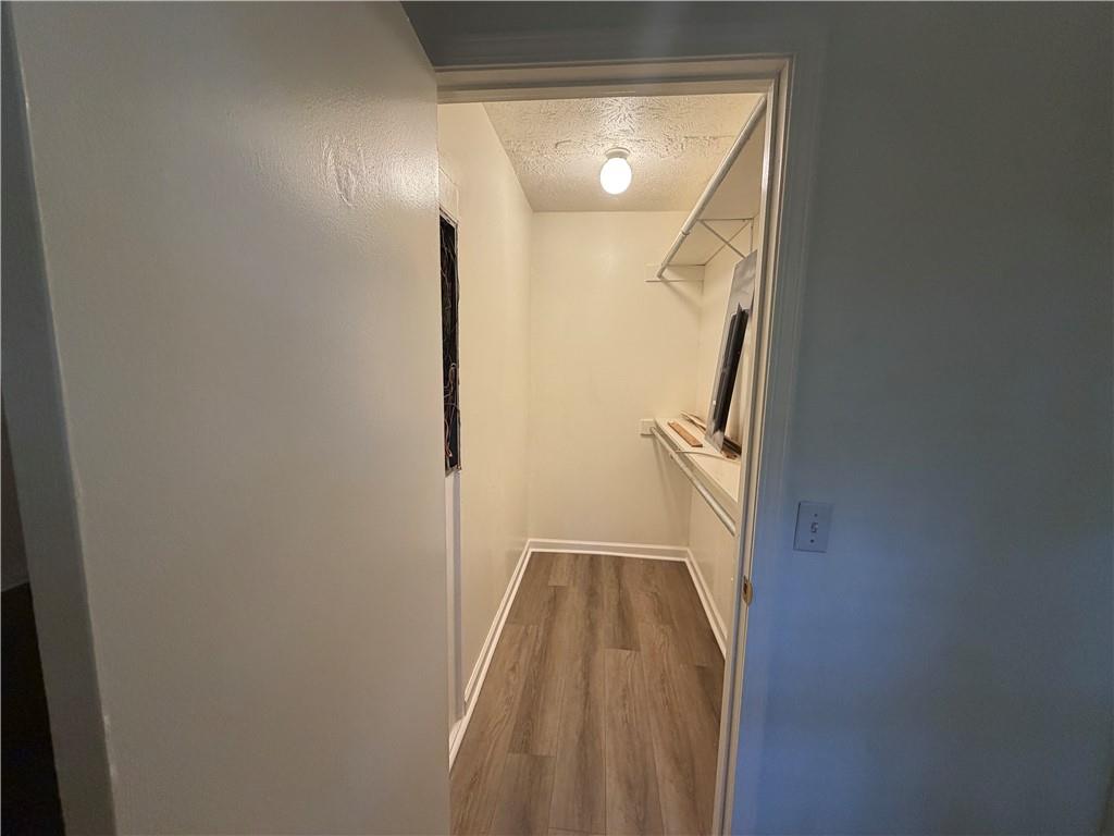 86 Robert Jones Road Dawsonville, GA 30534 - Photo 10 of 19 a view of a bathroom from a corridor