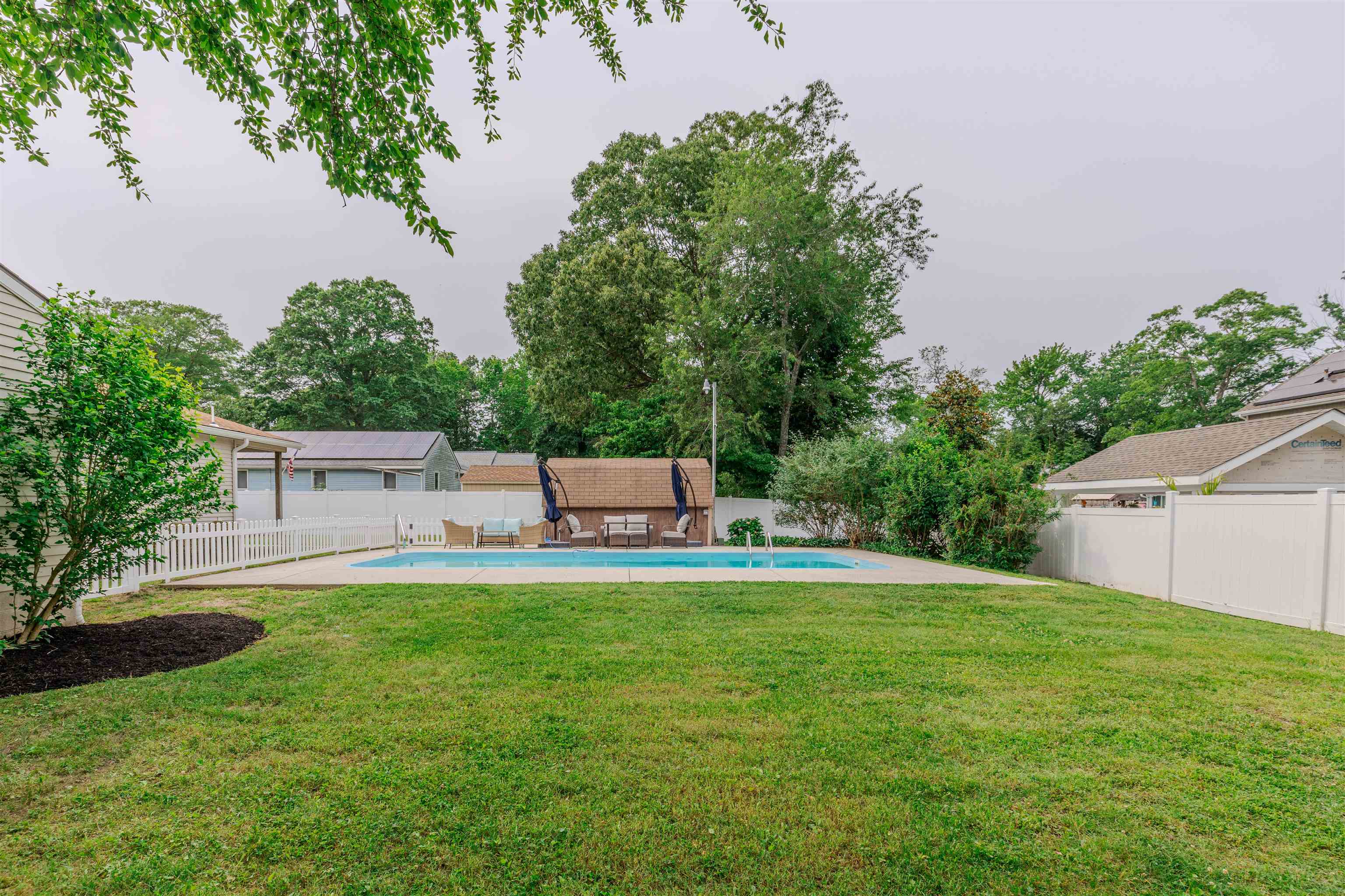 963 Tecumseh Road Erma, NJ 08204 - Photo 31 of 41 a house view with a sitting space and garden