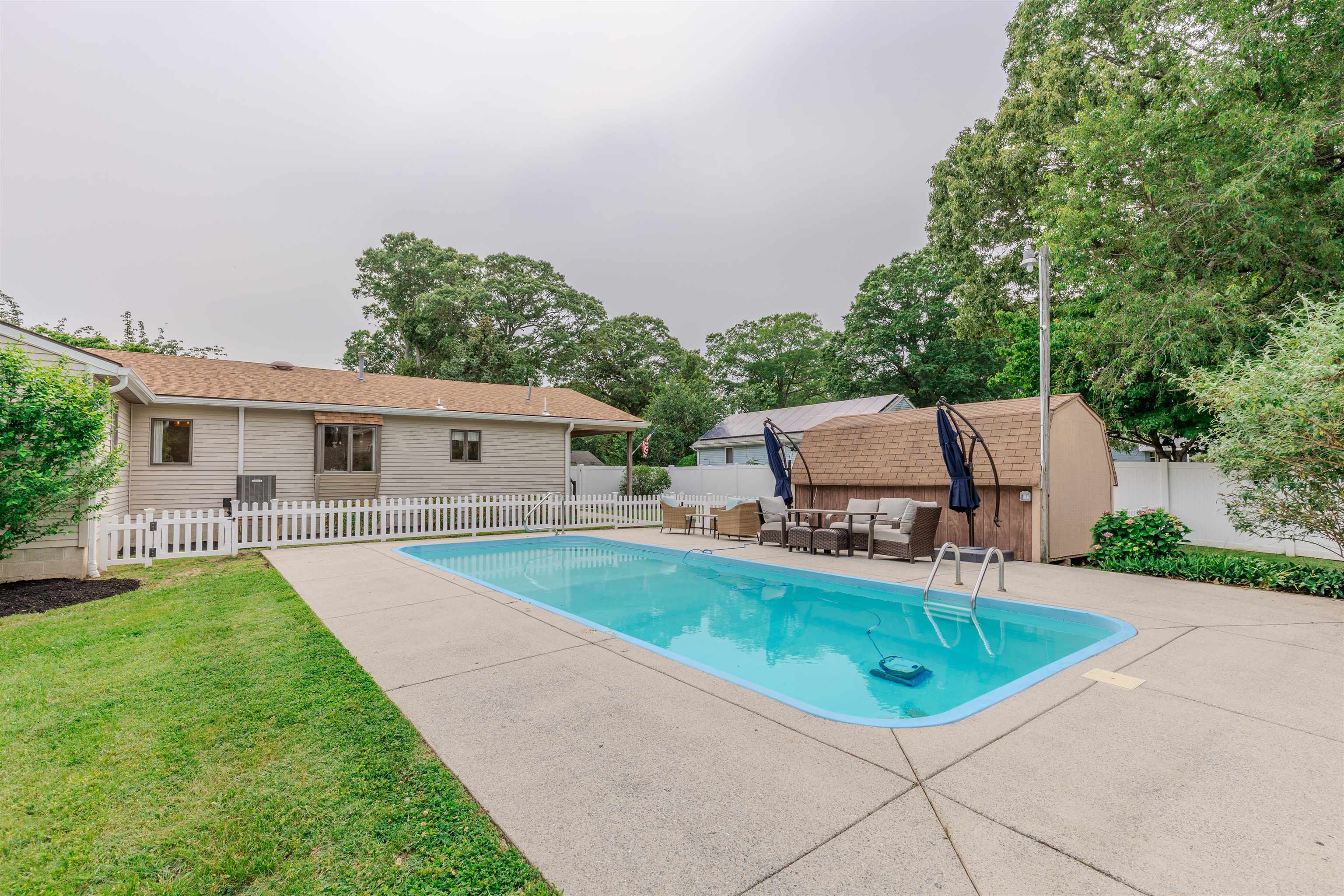 963 Tecumseh Road Erma, NJ 08204 - Photo 33 of 41 a view of a house with a yard porch and sitting area