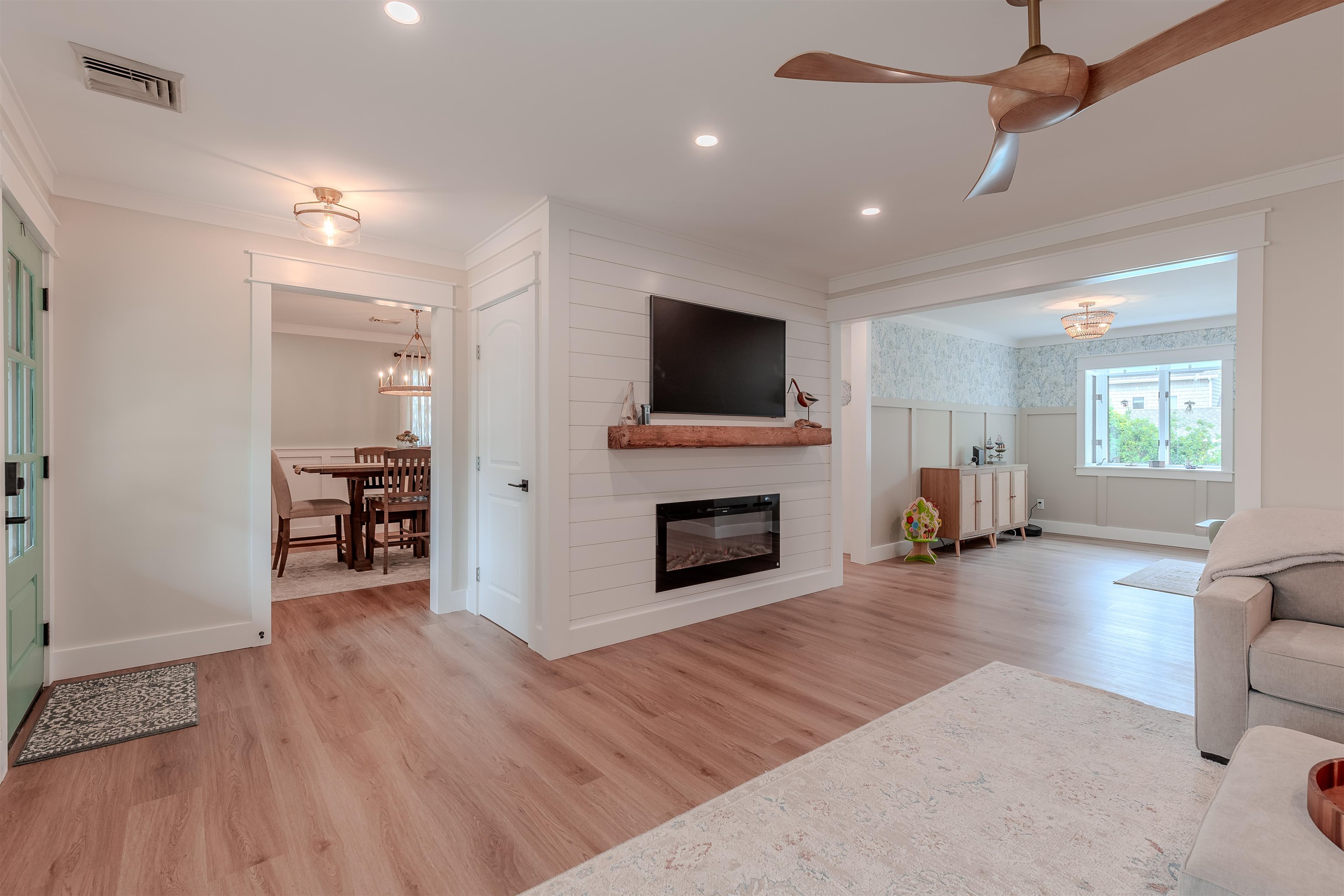963 Tecumseh Road Erma, NJ 08204 - Photo 8 of 41 a living room with furniture a fireplace and a flat screen tv