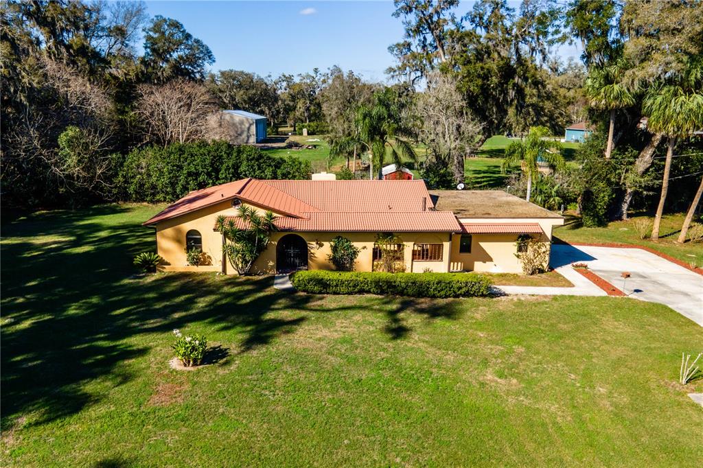 1255 Northeast 70th Street Ocala, FL 34479 - Photo 1 of 1 an aerial view of a house with yard swimming pool and outdoor seating