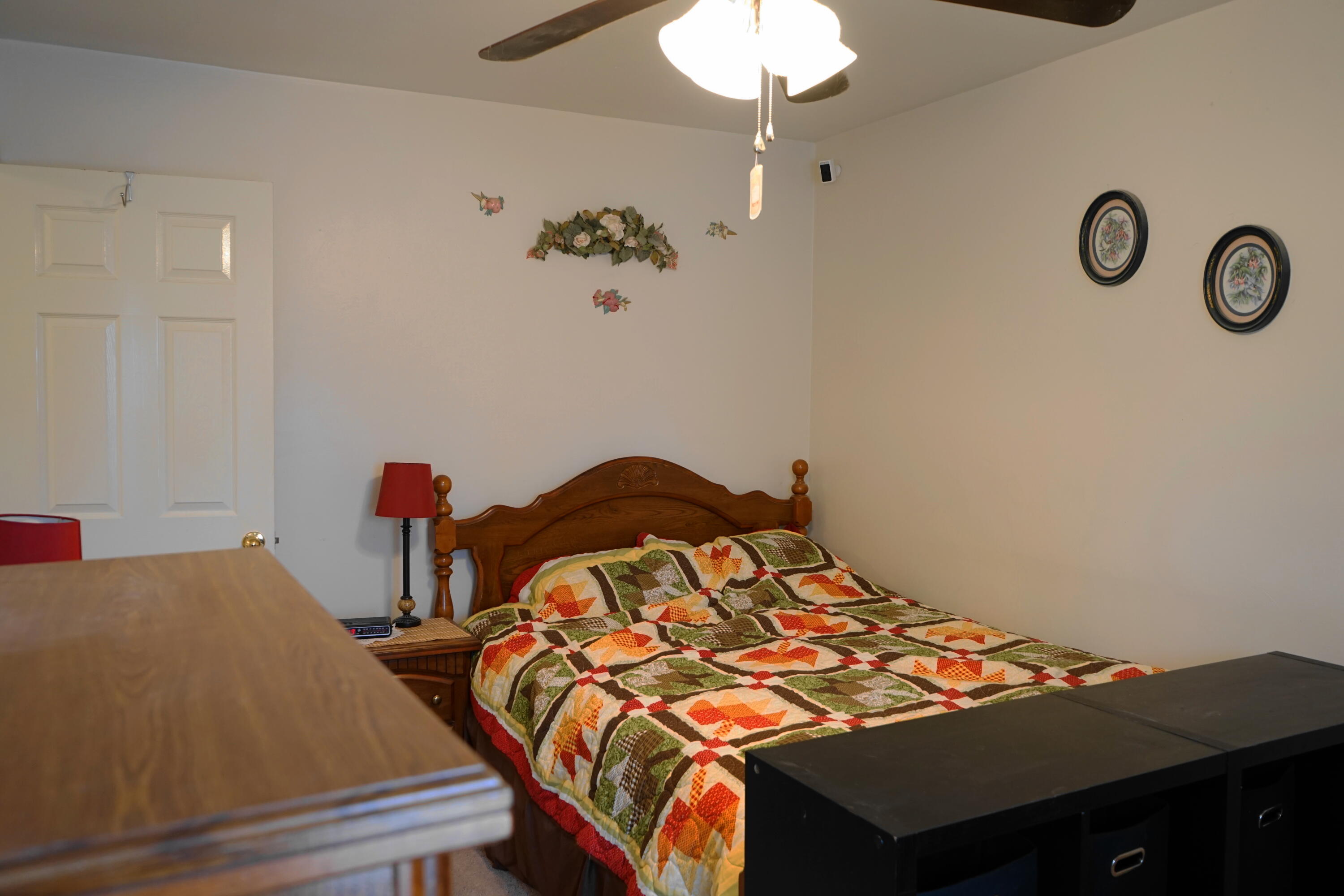 5320 Cove Road Roanoke, VA 24017 - Photo 17 of 30 a bedroom with a bed and a chandelier