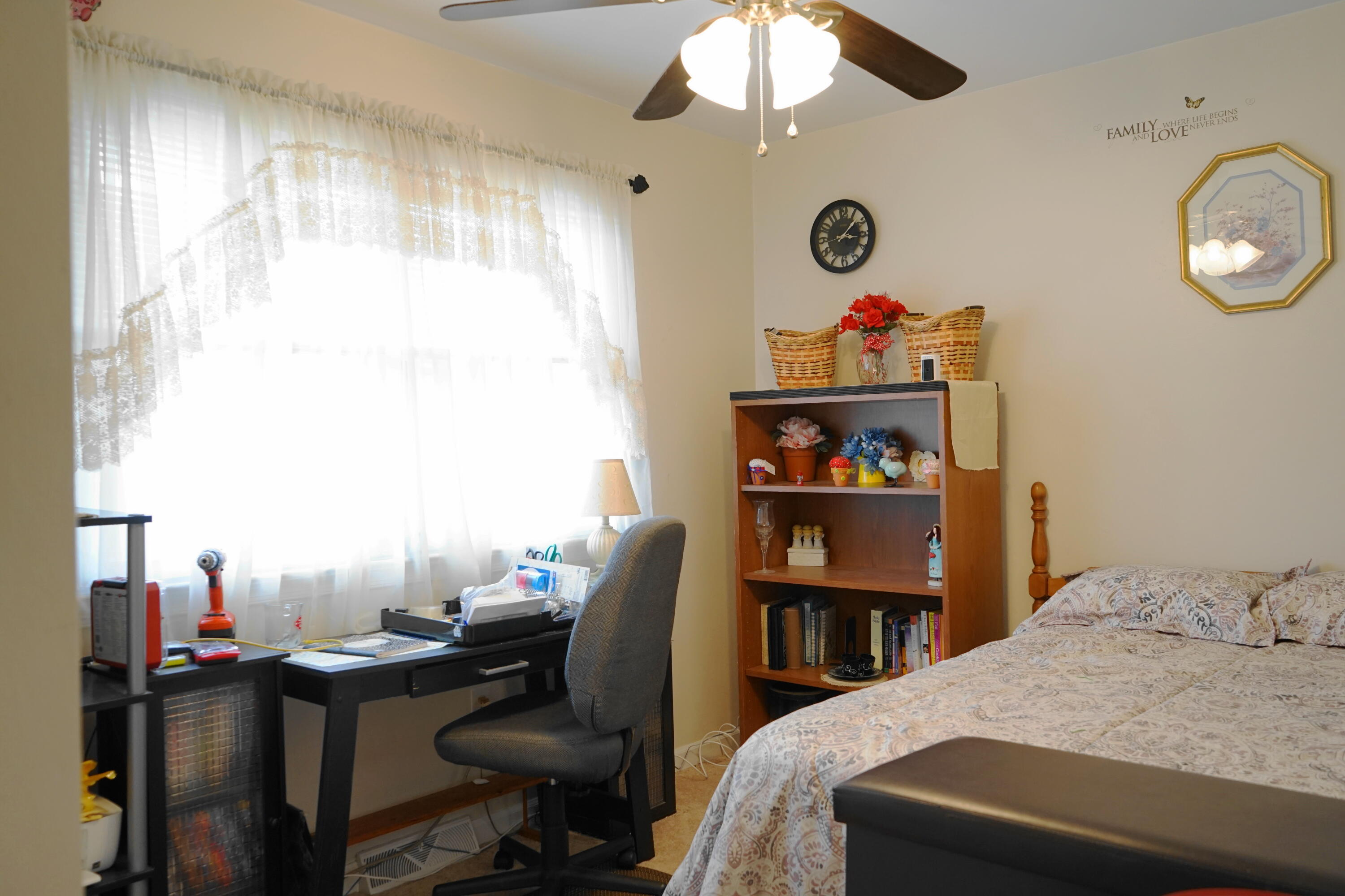 5320 Cove Road Roanoke, VA 24017 - Photo 20 of 30 a bedroom with a bed and a chandelier