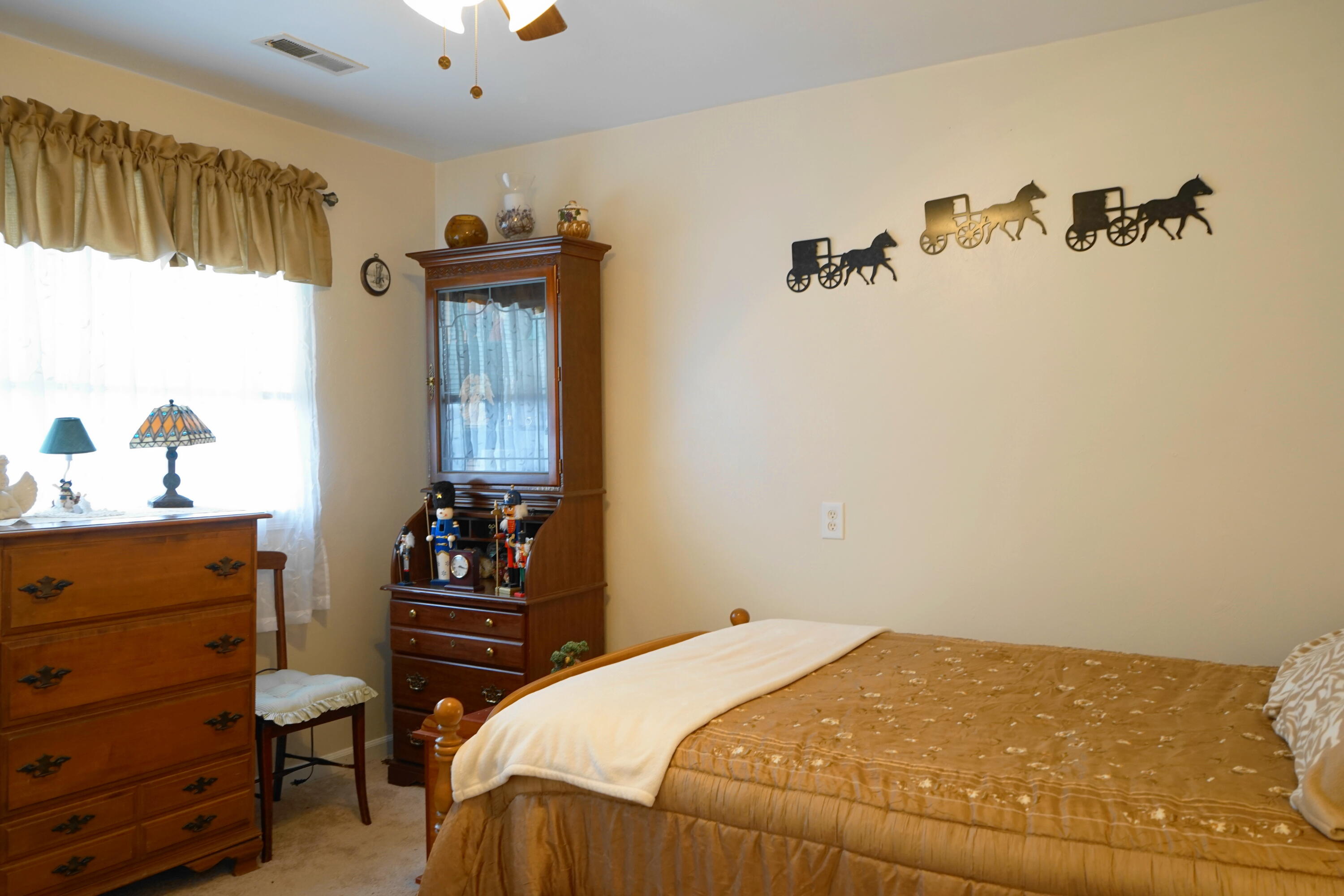 5320 Cove Road Roanoke, VA 24017 - Photo 27 of 30 a bedroom with a bed and a dresser