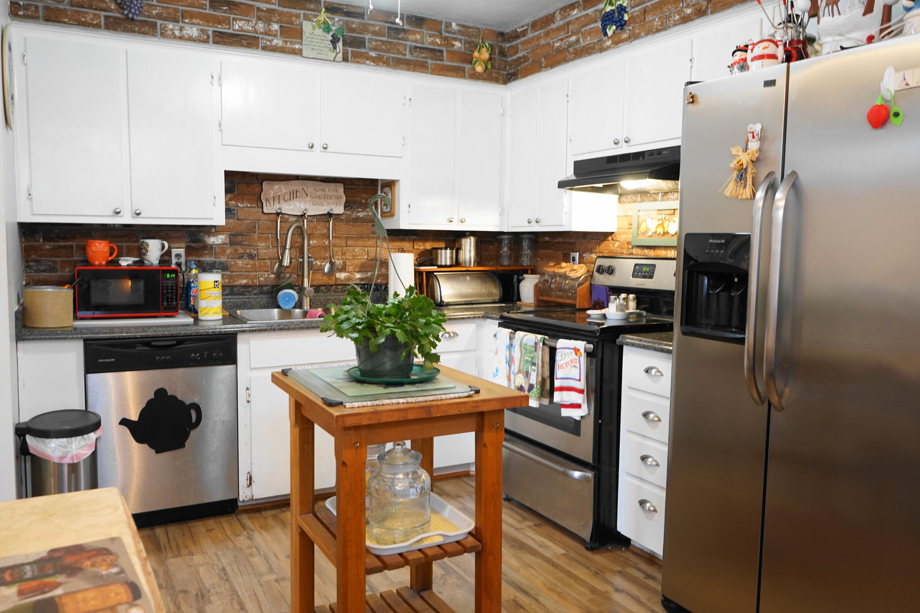 5320 Cove Road Roanoke, VA 24017 - Photo 10 of 30 a kitchen with stainless steel appliances granite countertop a refrigerator and a stove top oven