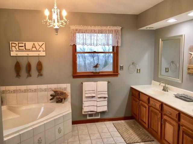 1245 Flatwoods Road Vanderbilt, PA 15486 - Photo 16 of 25 Luxurious Master Bathroom with Dual Sinks and Corner Bath.