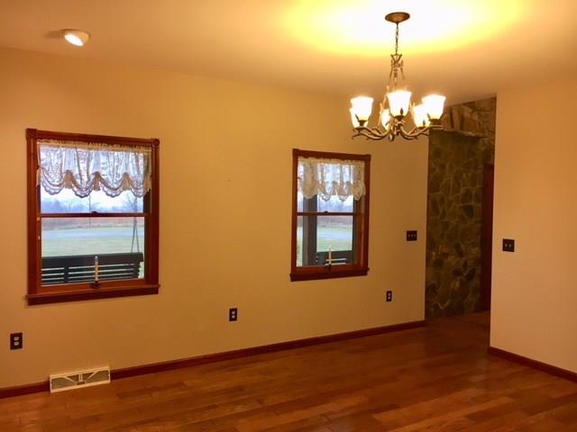 1245 Flatwoods Road Vanderbilt, PA 15486 - Photo 6 of 25 Formal Dining Area opens to the Step Down Family Room with shared Fireplace.