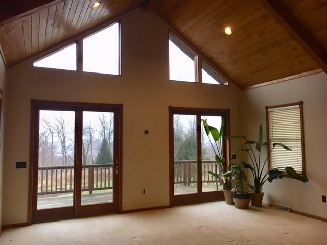 1245 Flatwoods Road Vanderbilt, PA 15486 - Photo 7 of 25 Beautiful Wood Cathedral Ceilings accent the Double Doors to the side Deck.