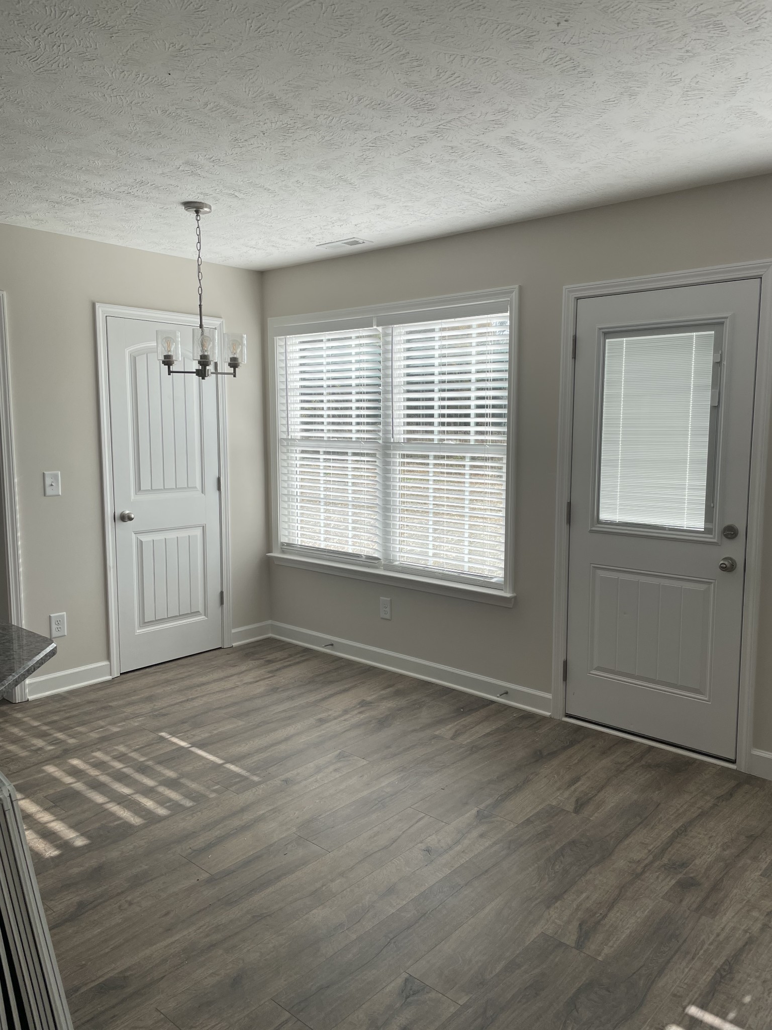 3213 Volta Road Christiana, TN 37037 - Photo 7 of 19 an empty room with wooden floor and windows