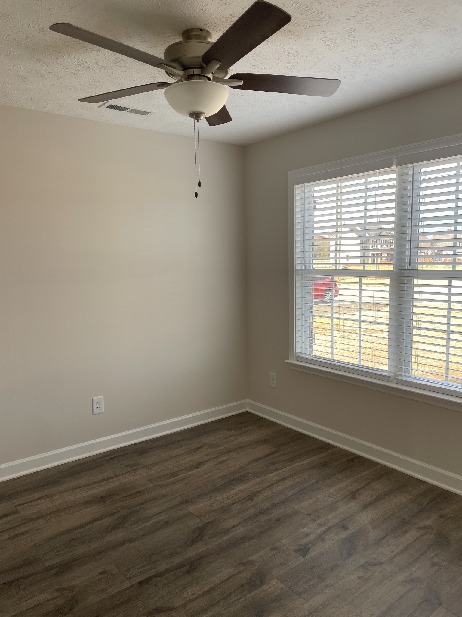 3213 Volta Road Christiana, TN 37037 - Photo 9 of 19 a view of an empty room with wooden floor and a window