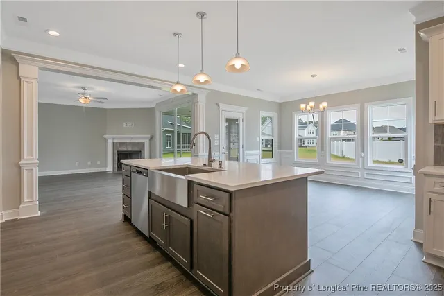 a large kitchen with granite countertop a large counter top and appliances