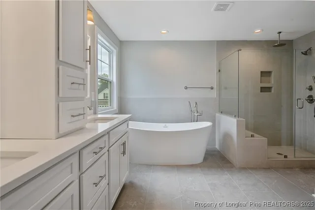 a bathroom with a shower and a sink