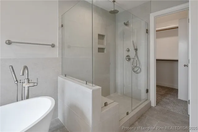 a white bath tub sitting in a bathroom