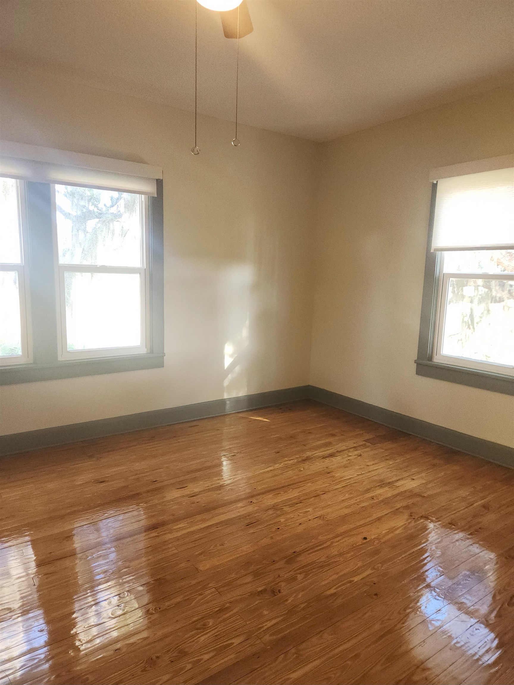 250 Brainard Drive, Unit A St. Augustine, FL 32086 - Photo 11 of 13 an empty room with wooden floor and windows