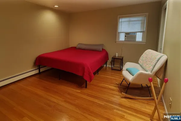 a bedroom with a bed and chair