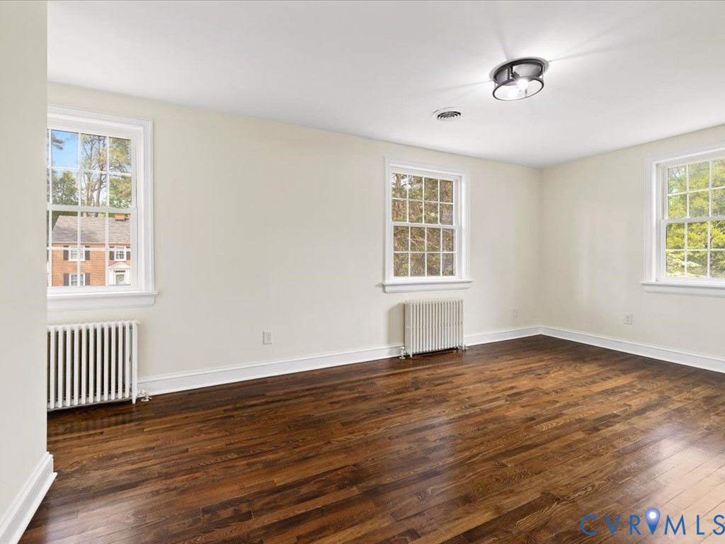 4803 Morrison Road Richmond, VA 23230 - Photo 32 of 45 a view of an empty room with wooden floor and a window