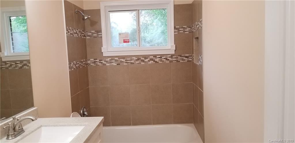 4226 Colebrook Road Charlotte, NC 28215 - Photo 7 of 11 a bathroom with a sink and shower