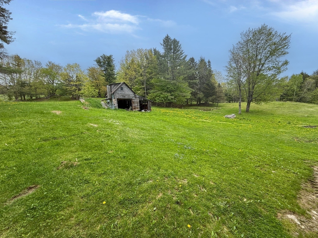 594 Route 8A Heath, MA 01340 - Photo 8 of 14 a view of a big yard with a house in the background