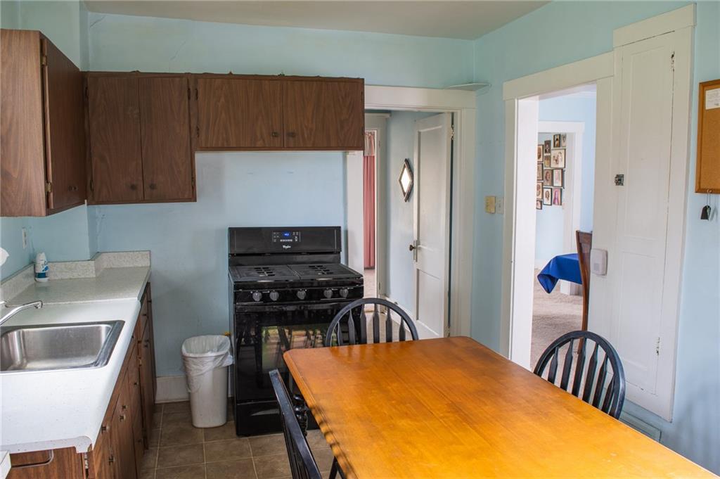 950 Stanford Road Pittsburgh, PA 15212 - Photo 15 of 25 Kitchen includes refrigerator and stainless steel gas stove