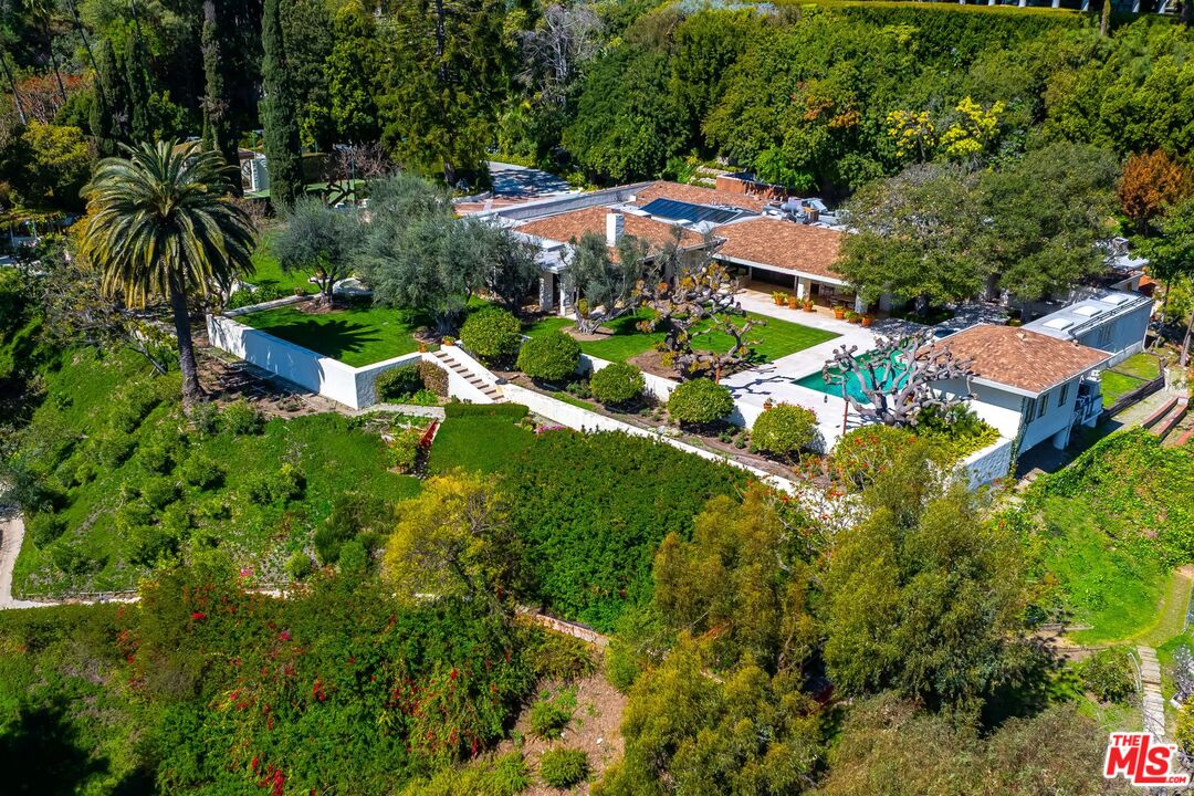 750 Lausanne Road Los Angeles, CA 90077 - Photo 15 of 16 an aerial view of residential houses with outdoor space and trees