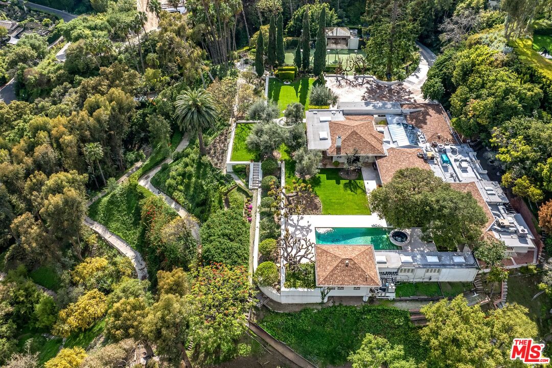750 Lausanne Road Los Angeles, CA 90077 - Photo 3 of 16 an aerial view of residential houses with outdoor space and trees