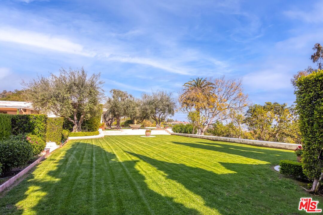 750 Lausanne Road Los Angeles, CA 90077 - Photo 9 of 16 a view of a golf course with a lake