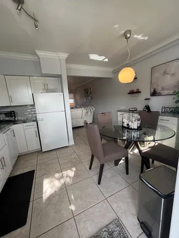 a view of kitchen and dining room with furniture