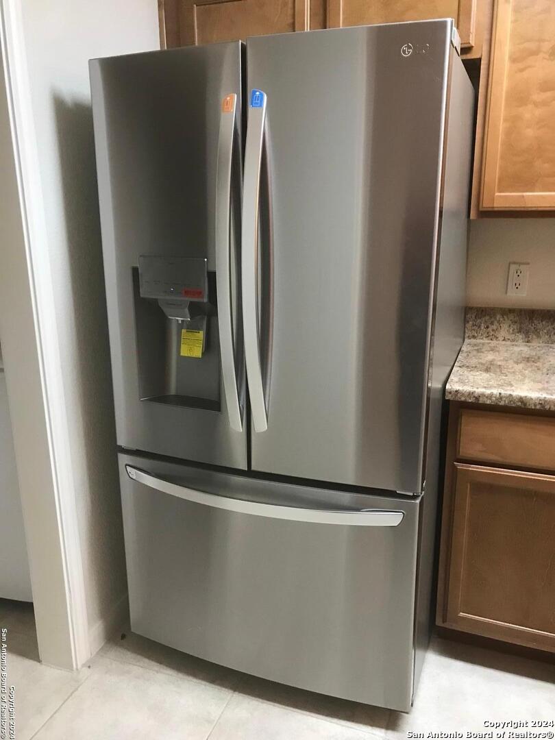 7323 Snowden Road, Unit 3108 San Antonio, TX 78229 - Photo 6 of 31 a view of a refrigerator in kitchen