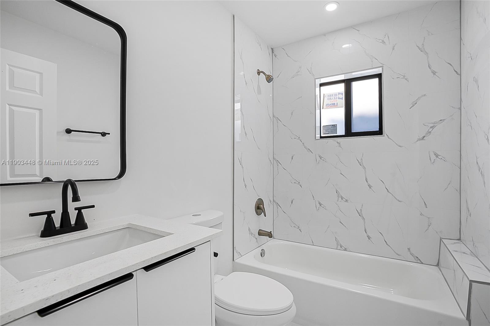 10362 Southwest 180th Street, Unit 3 Miami, FL 33157 - Photo 10 of 17 a bathroom with a sink a toilet and shower