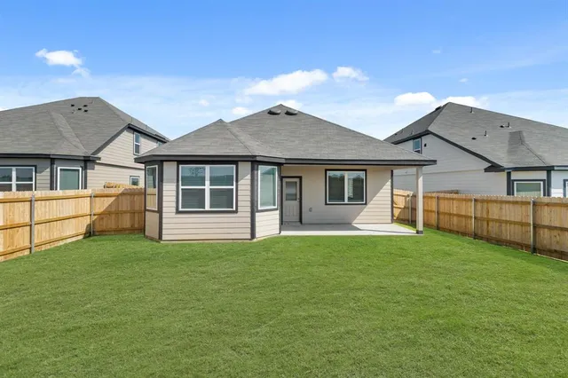 a view of a house with a yard and porch