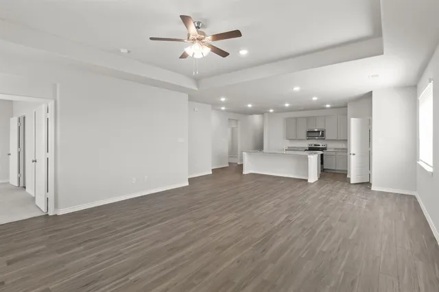 a view of kitchen with cabinets and wooden floor