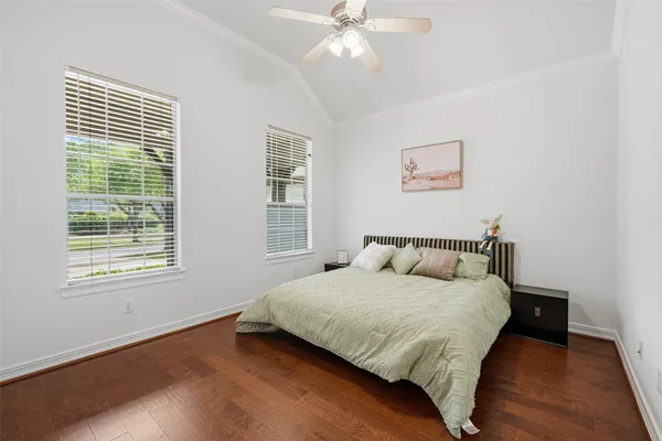a large kitchen with a sink and dishwasher a stove top oven with wooden floor